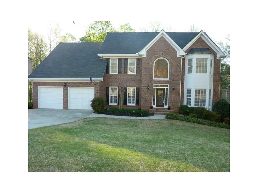 Exterior Front. Beautiful brick home nestled on a 