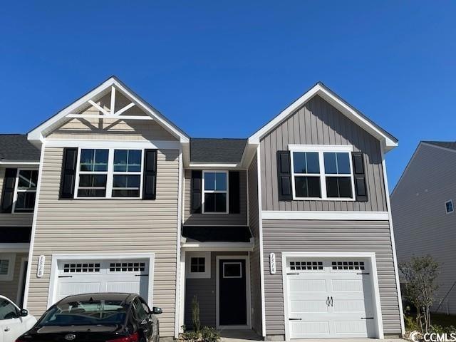 View of front of home featuring a garage