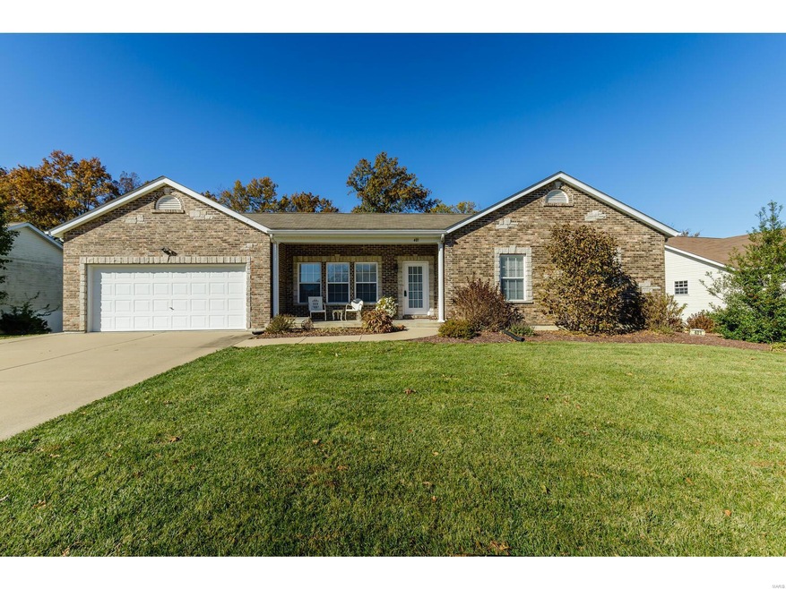 Full Brick Front with Stone Accents. Covered Front