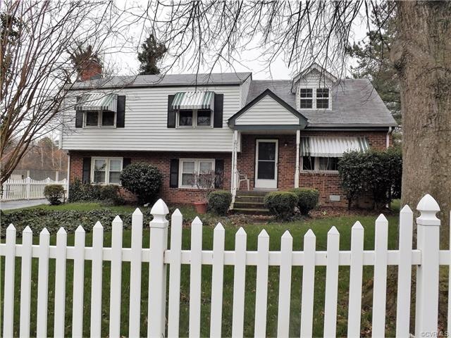Great Brick and Viny Home with fenced in yard.