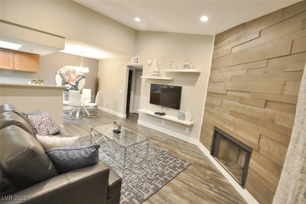 Living room with wood walls, a chandelier, wood fi