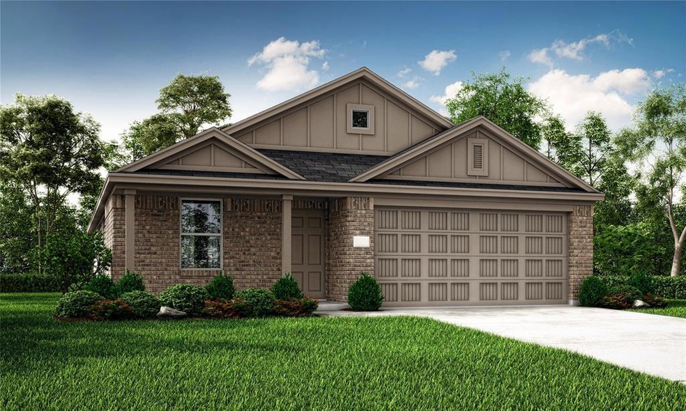 View of front facade featuring driveway, an attach