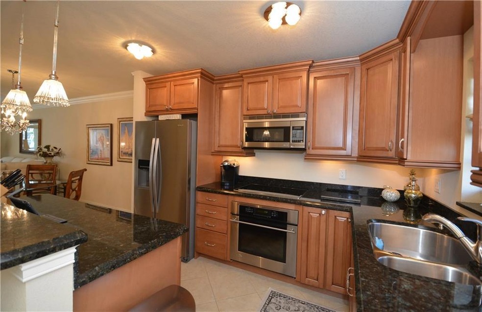 Open Kitchen features ample cabinet and counter to