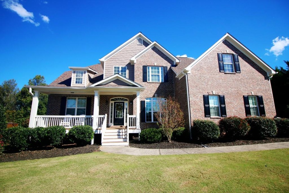 Beautiful brick and shake with rocking chair front
