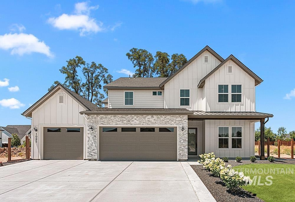 Modern inspired farmhouse featuring board and batten siding, concrete driveway, a front lawn, a standing seam roof, and a garage