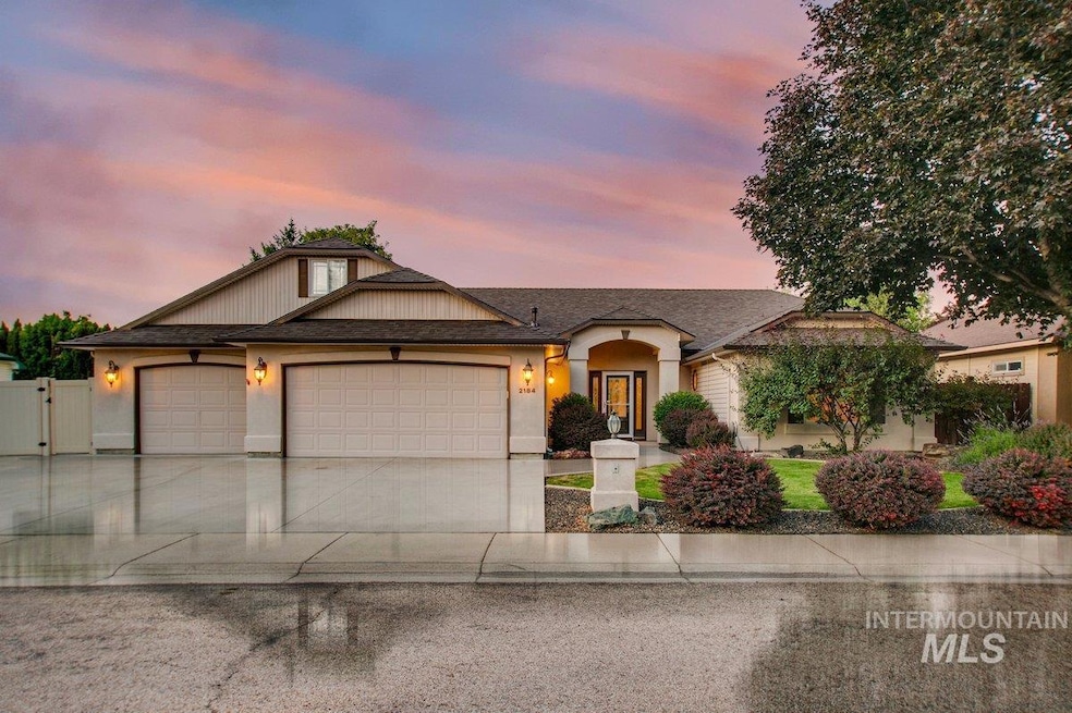 Ranch-style home featuring an attached garage, concrete driveway, stucco siding, a gate, and roof with shingles