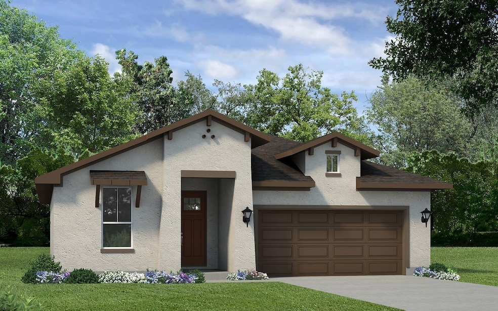 View of front of home with a garage, stucco sidin