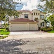 Exterior View with three car garage. Garage has bu