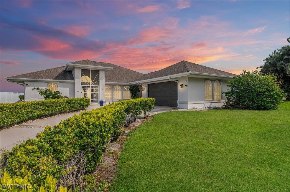 View of front of house featuring a garage and a la