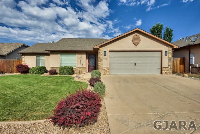 This stucco-and-stone home is low-maintenance - an