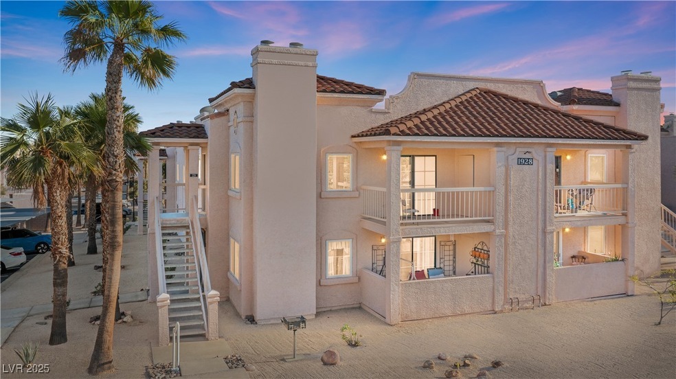 Front of property at dusk with a balcony, stairway