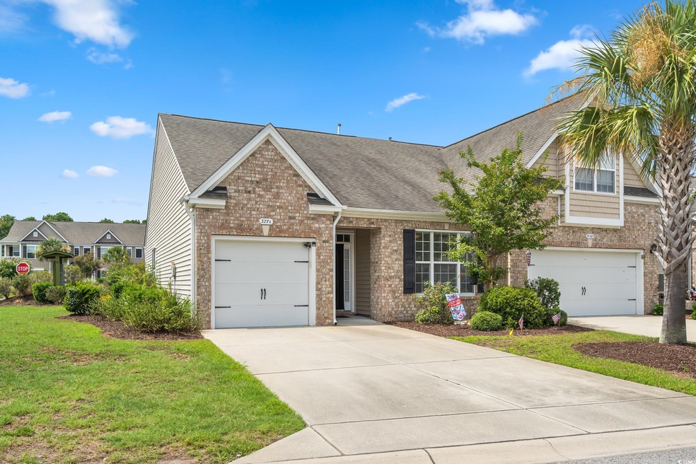 View of front of property with a front yard
