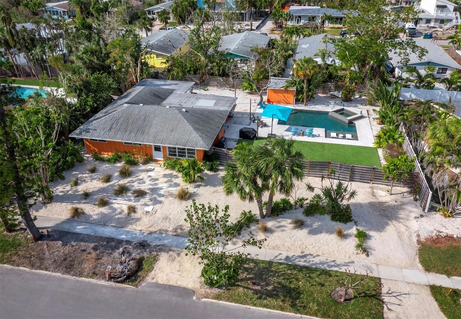 Renovate or build your dream home! This expansive elevated lot offers a private oasis with pool and spa.