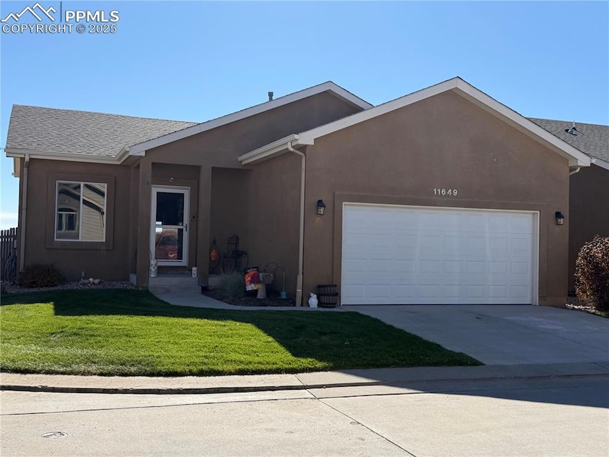 Single story home featuring a front yard, stucco siding, a garage, concrete driveway, and a shingled roof