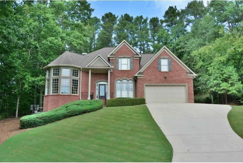 Exterior Front. Spectacular home with lush lawn an