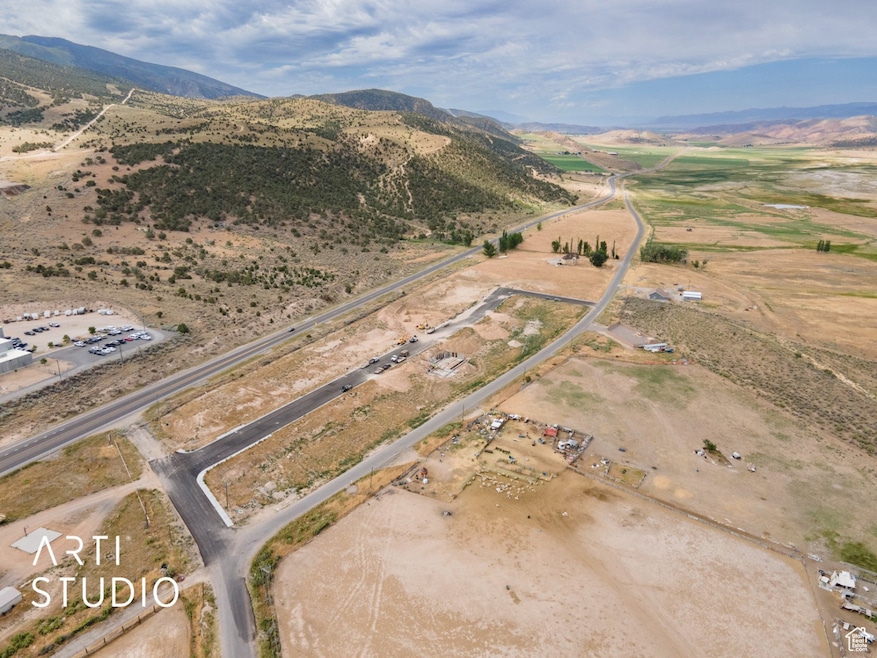 Aerial view of property's location featuring rural landscape and mountains