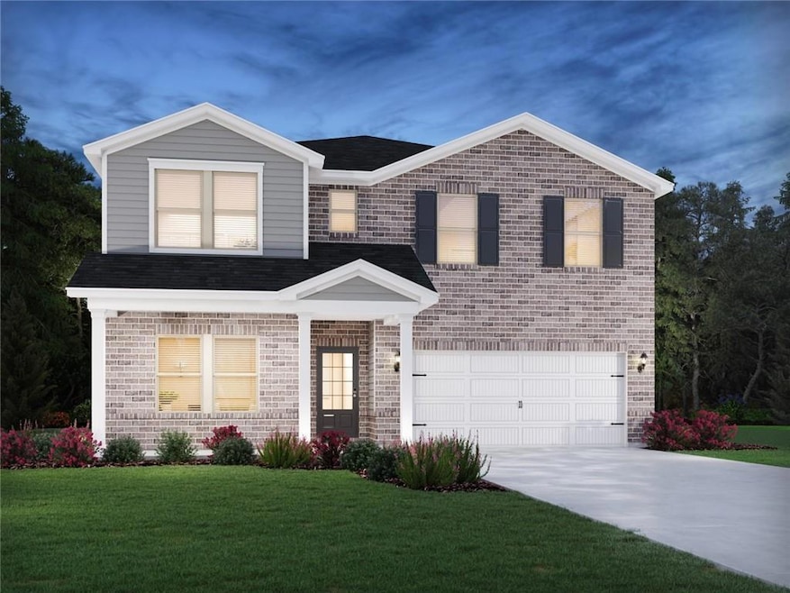 View of front of house with brick siding, driveway, a front lawn, an attached garage, and a shingled roof