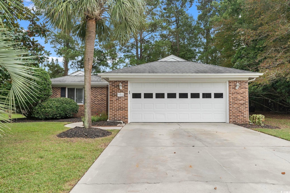 Single story home with a garage and a front yard