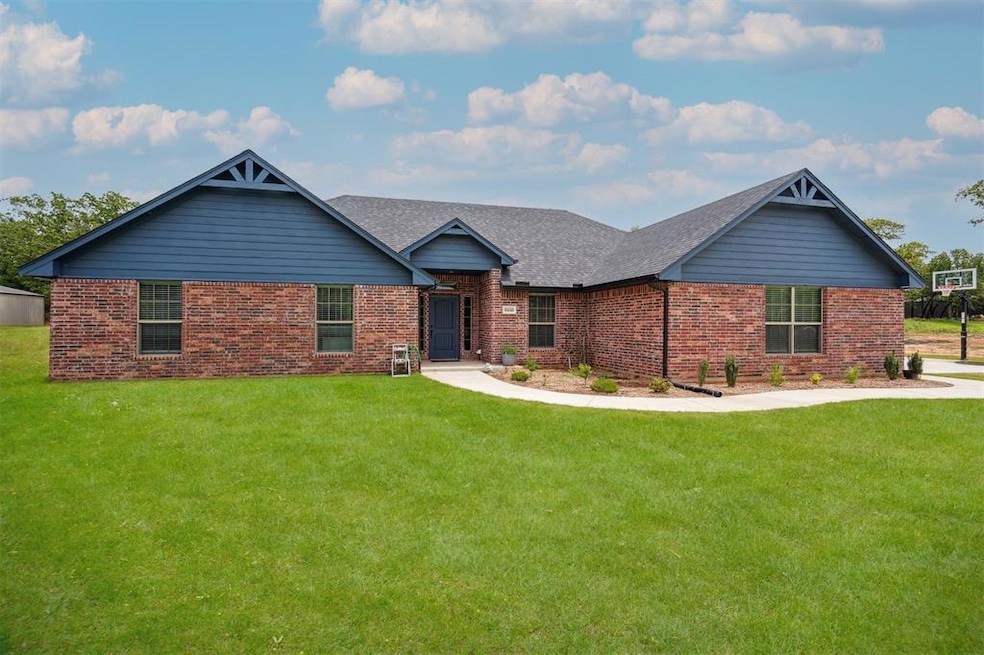 View of front of property with a shingled roof, br