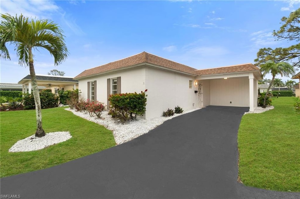 View of front of property featuring a carport and 