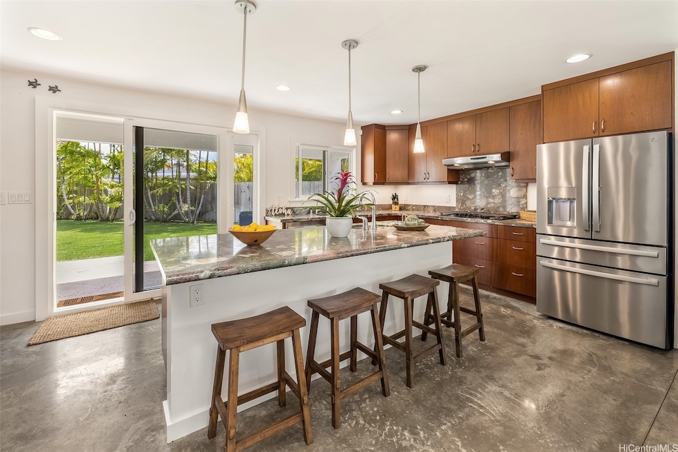 The spacious open gourmet kitchen, opening out to