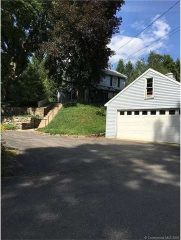 Front of house with two car detached garage