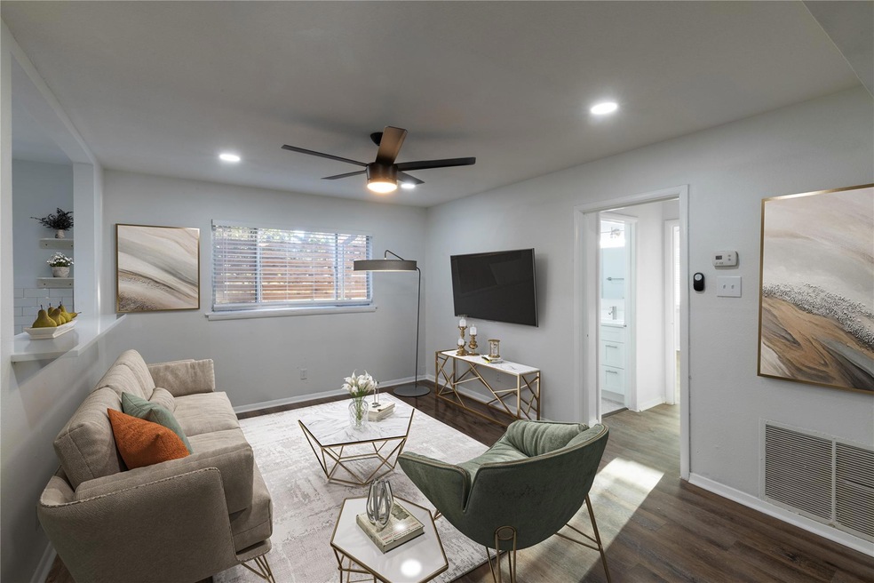 Living area featuring recessed lighting, visible v