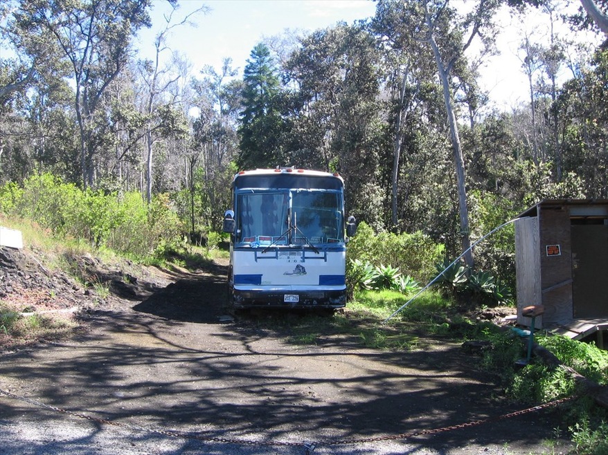 Bus is near street on front of lot.