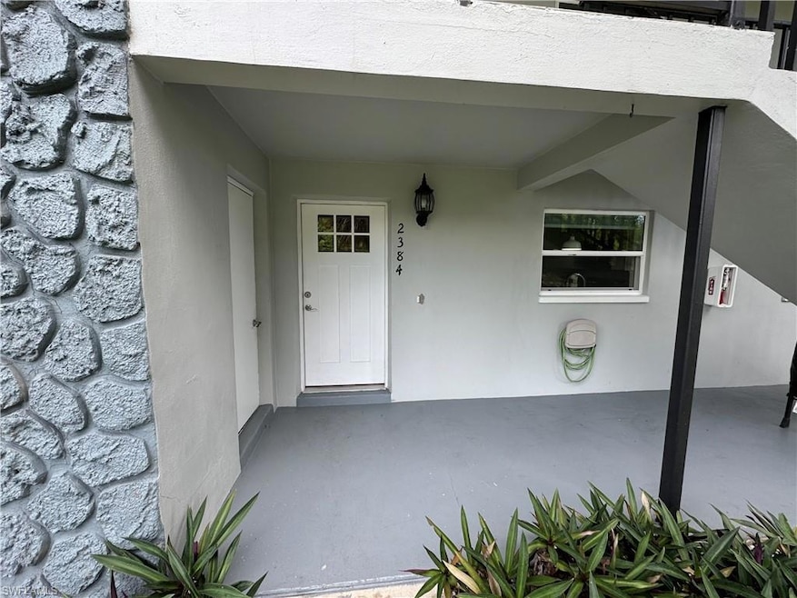 Doorway to property featuring a patio