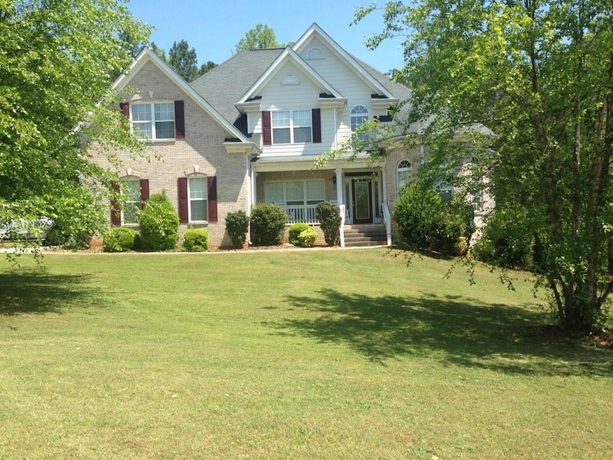 Craftsman-style home featuring a front lawn
