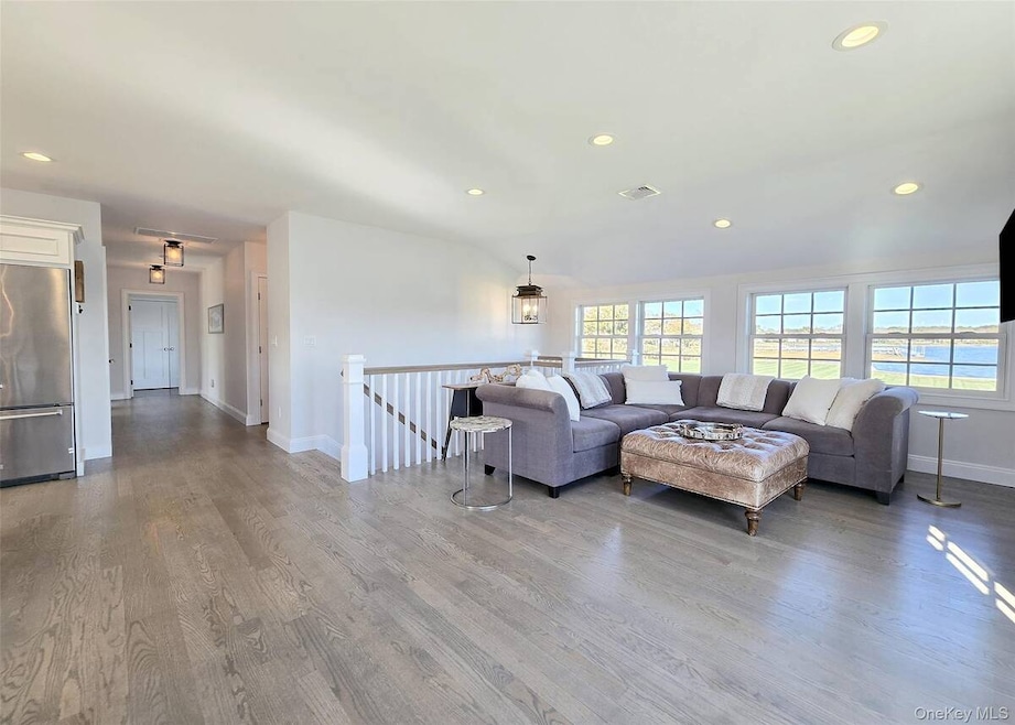 Living area featuring recessed lighting and light wood-type flooring