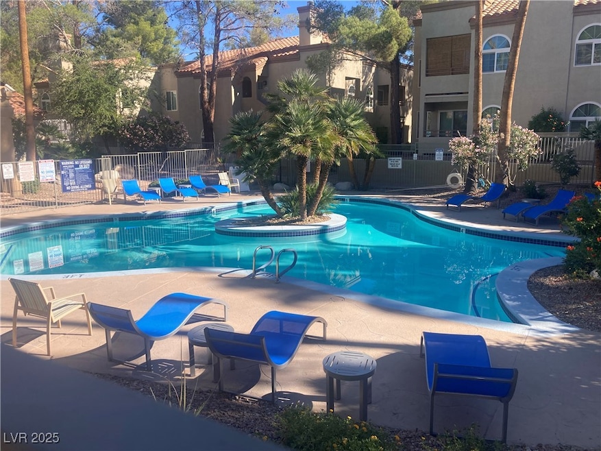 Community pool with a patio area