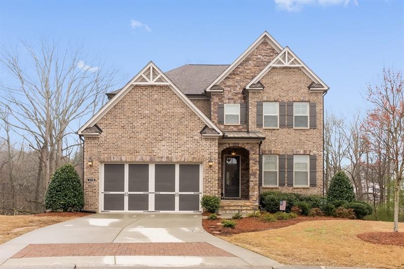 Gorgeous, 3-sides brick home nestled perfectly on 