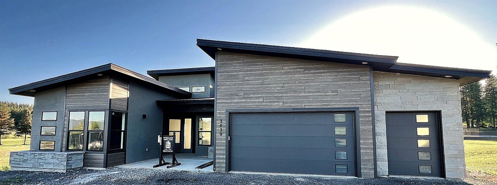 View of front facade featuring stone siding