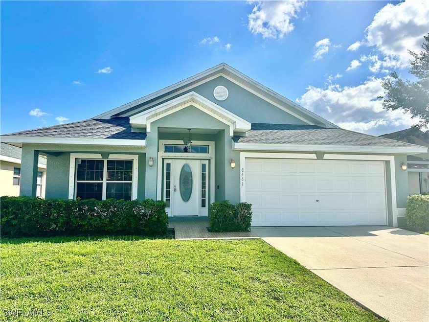 Single story home with stucco siding, driveway, a