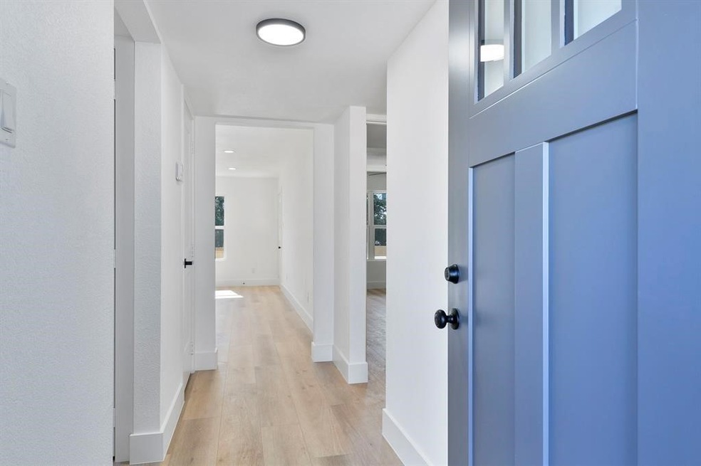 Bright and inviting entrance with a modern blue do