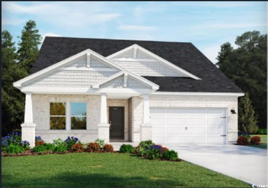 Craftsman-style house with an attached garage, driveway, a front yard, and brick siding