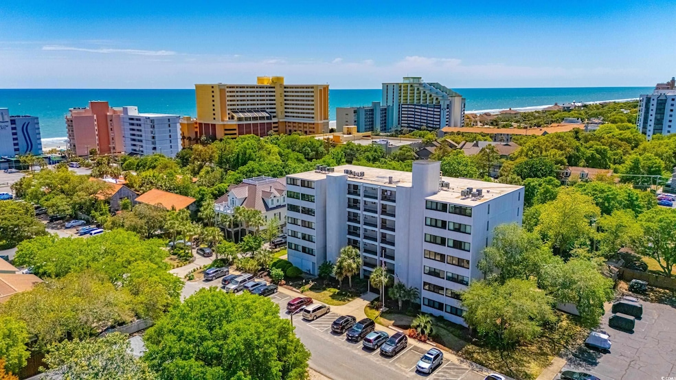 Drone / aerial view with a water view and a city v