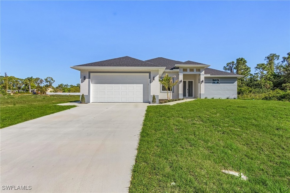 Prairie-style house featuring stucco siding, drive