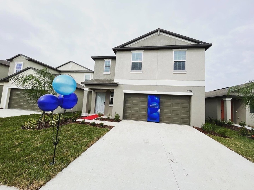 31454 Barrel Wave Way, Wesley Chapel, FL 33545 - photo 1