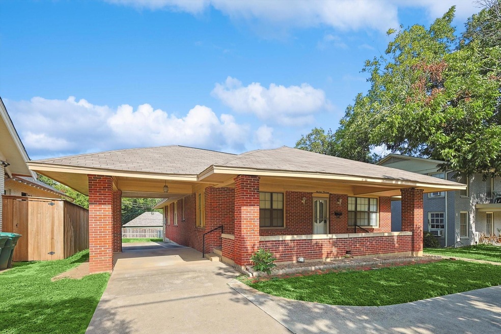 View of front of home featuring a carport and a fr