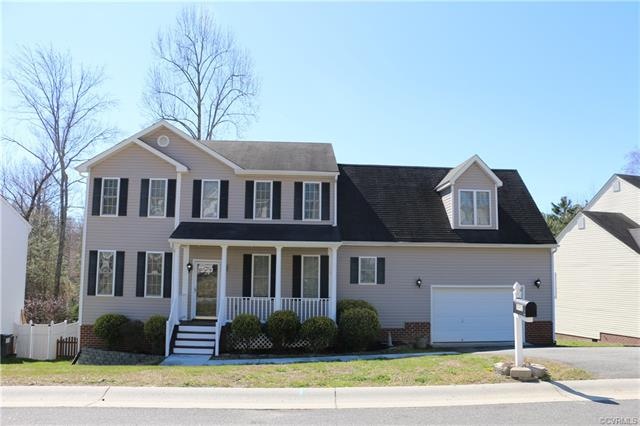 Front of house showing covered front porch, concre