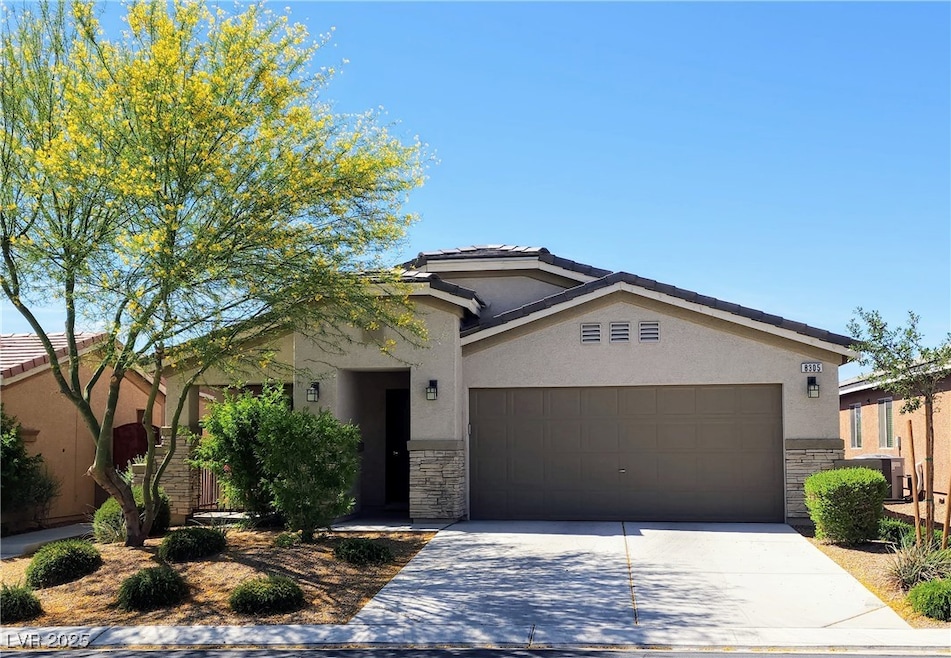 Single story home with stone siding, stucco siding
