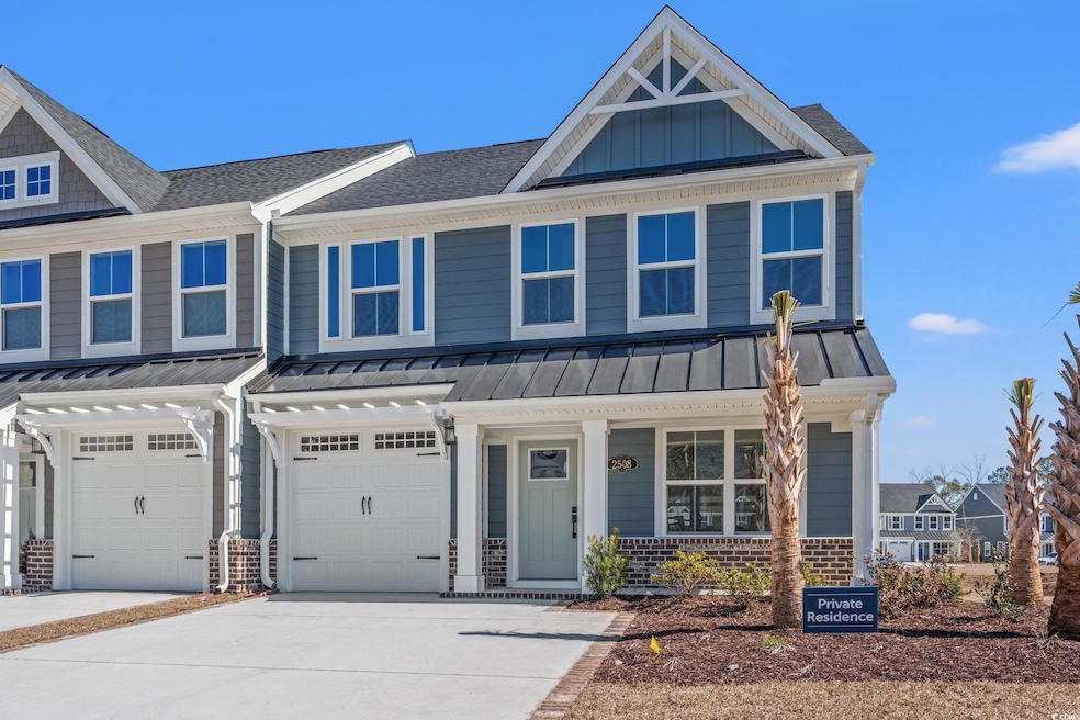 Townhome / multi-family property featuring brick s