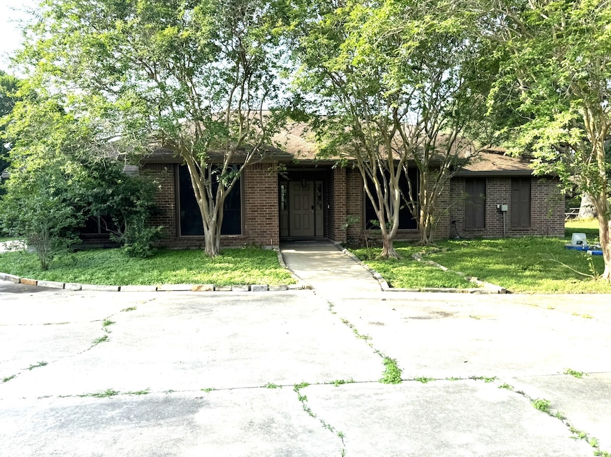 Gorgeous brick home with large concrete drive.