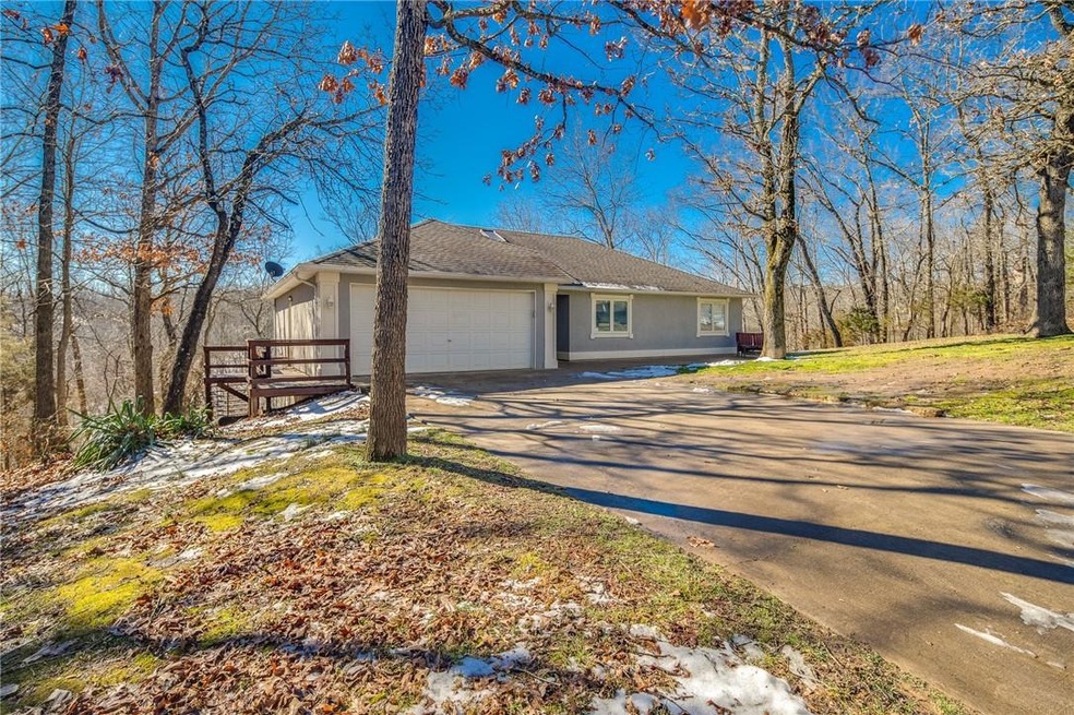 Welcome home!  Flat front yard and driveway to attached 2 car garage.