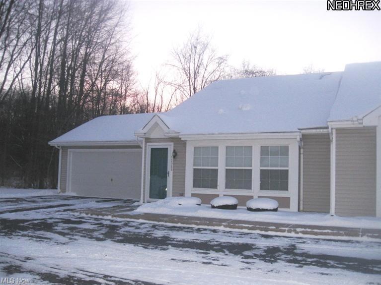Desirable End unit Condo with 2 car garage and ple