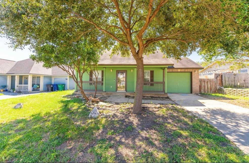 Ranch-style house featuring an attached garage, c