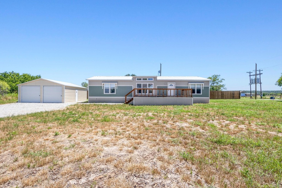 View of front of house with an outdoor structure, 