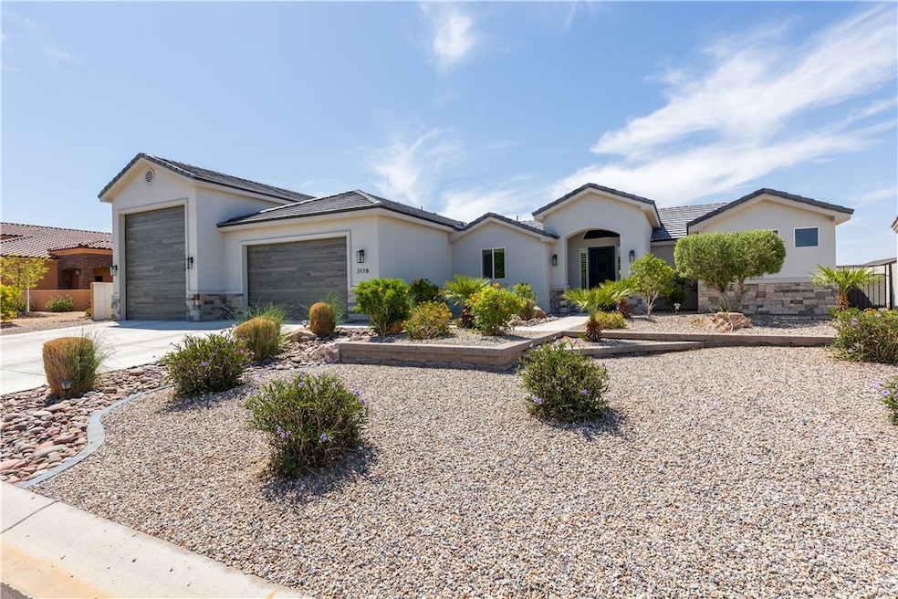 Single story home featuring stucco siding, drivewa